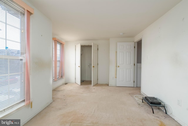 bedroom featuring light colored carpet