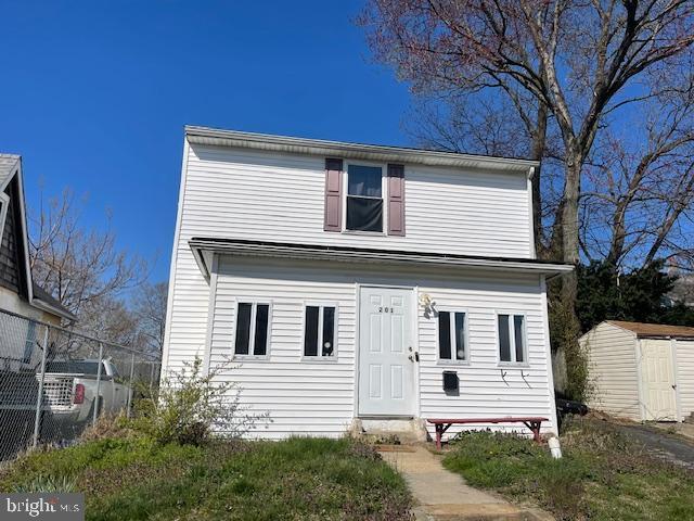 view of front facade with a storage unit