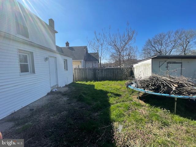 view of yard with a trampoline