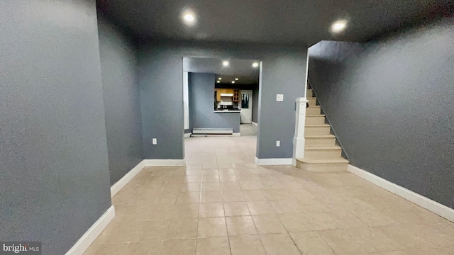 interior space featuring light tile patterned floors and a baseboard radiator