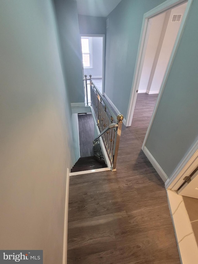 staircase featuring hardwood / wood-style flooring