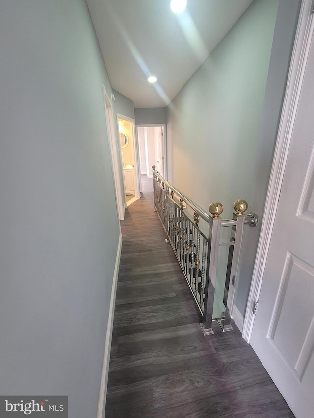 hall with dark hardwood / wood-style flooring