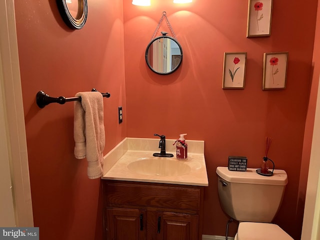 bathroom with toilet and vanity