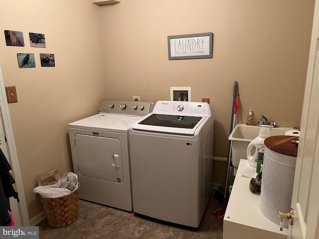 laundry room featuring sink and washing machine and clothes dryer