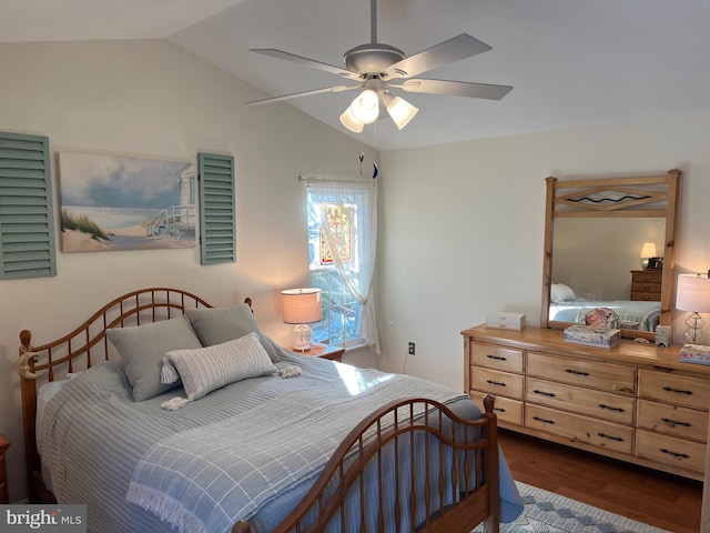 bedroom with lofted ceiling, ceiling fan, and dark hardwood / wood-style flooring