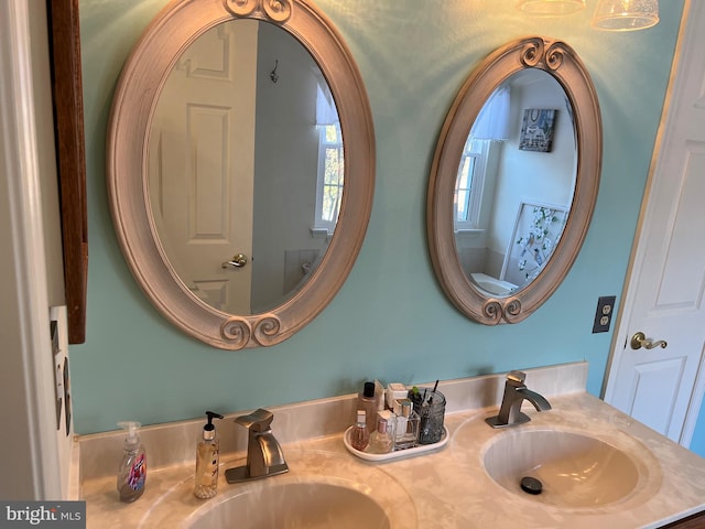 bathroom featuring toilet and vanity