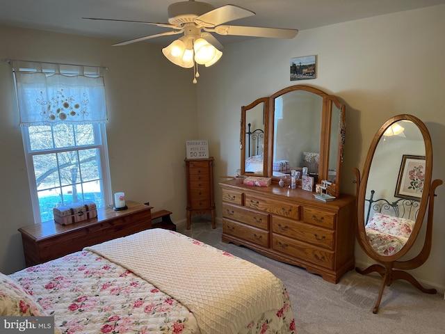 bedroom with ceiling fan and carpet flooring