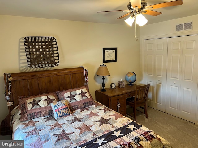 bedroom with carpet floors, ceiling fan, and a closet