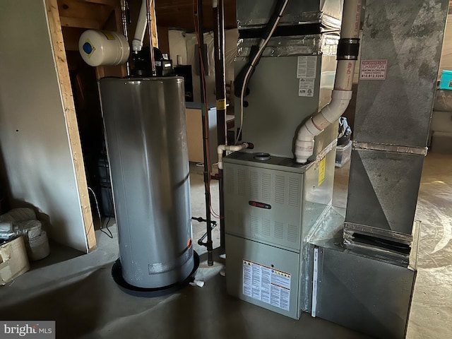 utility room with water heater and heating unit