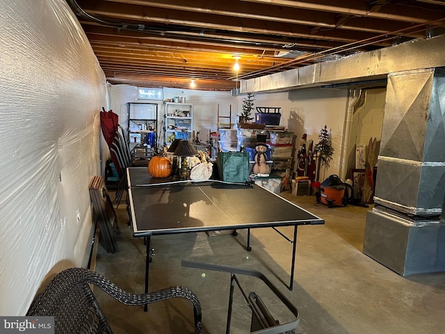 recreation room featuring concrete flooring