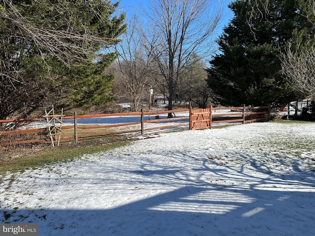 view of yard layered in snow