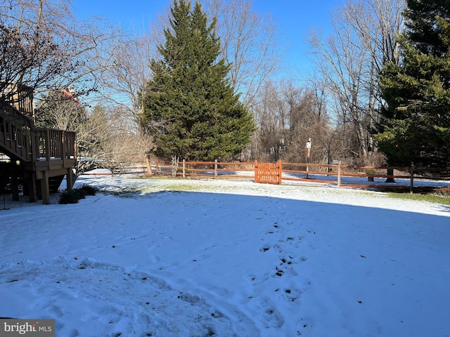 view of yard covered in snow