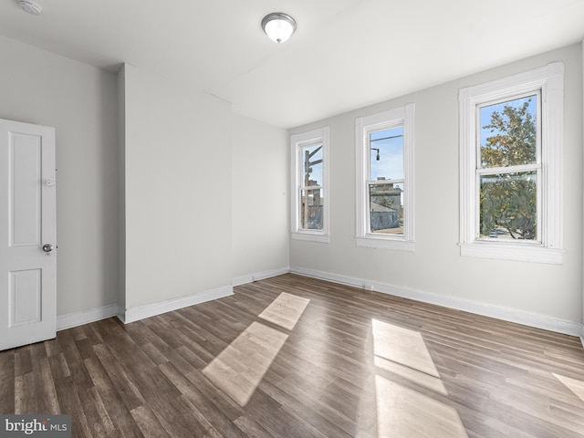 empty room featuring dark hardwood / wood-style floors