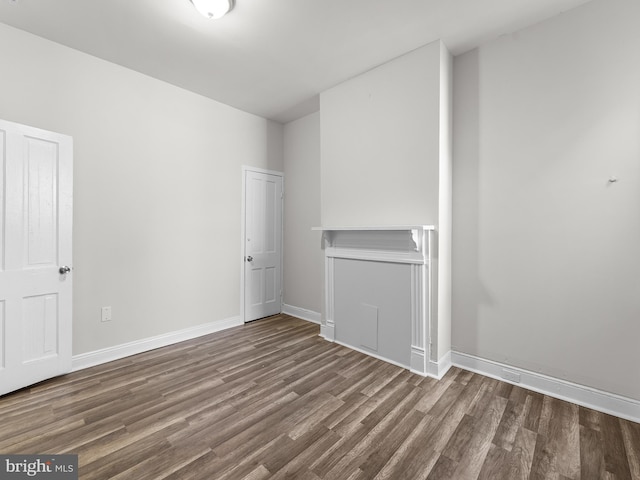 unfurnished room with hardwood / wood-style flooring