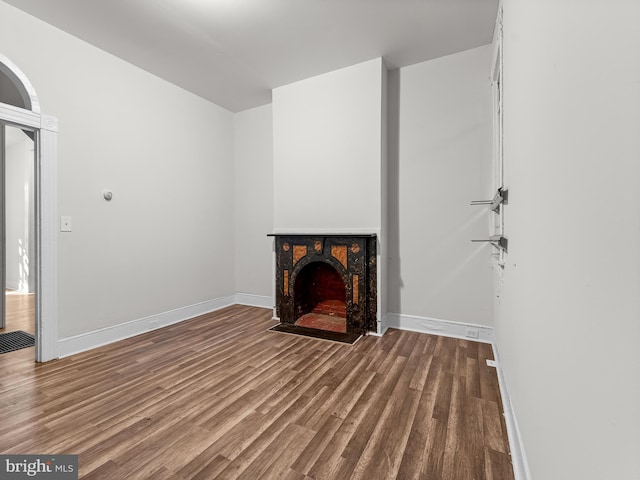 unfurnished living room featuring wood-type flooring