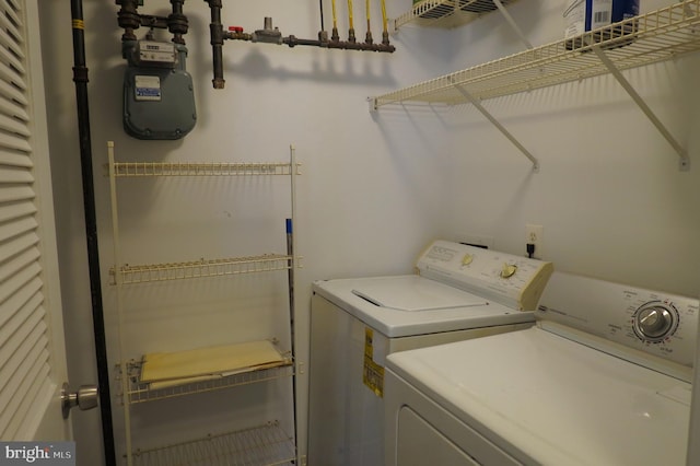 laundry room featuring separate washer and dryer