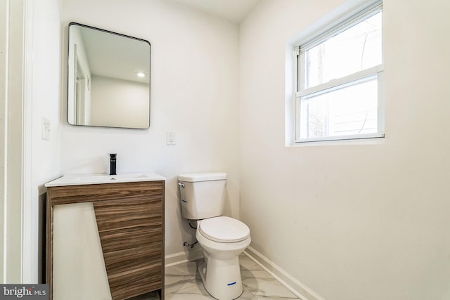 bathroom with toilet and vanity