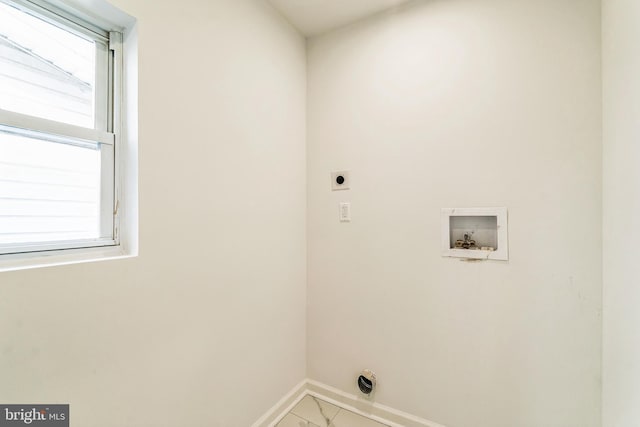 laundry area with electric dryer hookup, washer hookup, and plenty of natural light