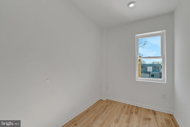 spare room with light hardwood / wood-style flooring