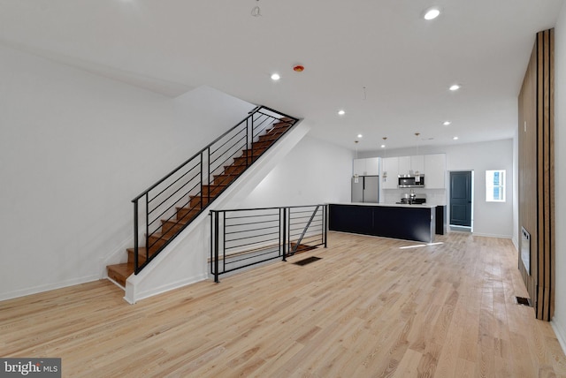 living room featuring light wood-type flooring