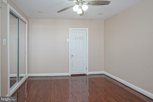 spare room featuring ceiling fan and hardwood / wood-style floors