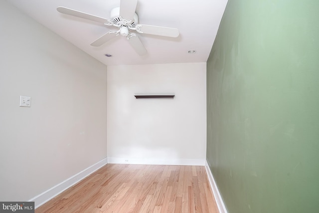 spare room with ceiling fan and light wood-type flooring