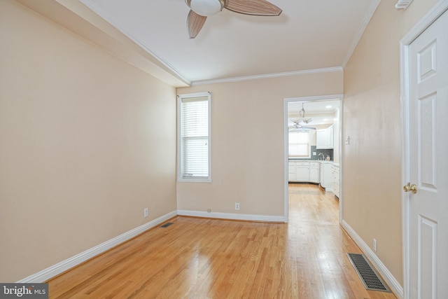 unfurnished room with light hardwood / wood-style flooring, crown molding, and ceiling fan with notable chandelier