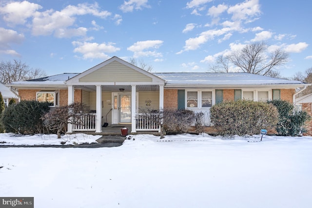 ranch-style home featuring a porch