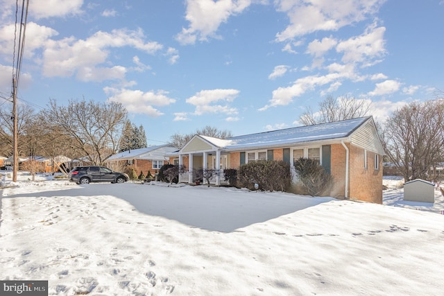 ranch-style home with covered porch