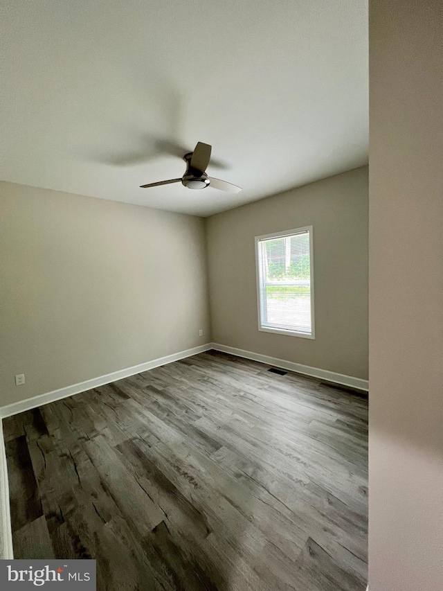 unfurnished room featuring ceiling fan and wood-type flooring