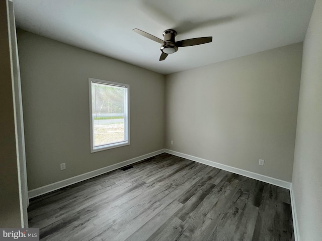 empty room featuring hardwood / wood-style flooring and ceiling fan