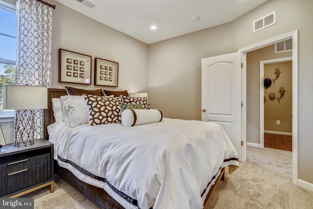 bedroom with light carpet