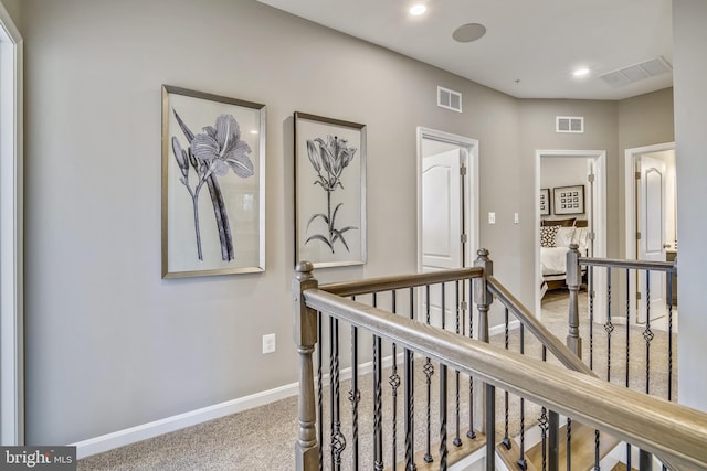 hallway with carpet floors