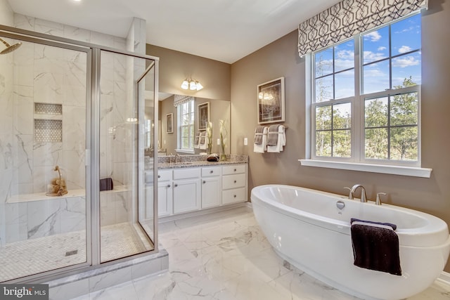 bathroom with separate shower and tub and vanity