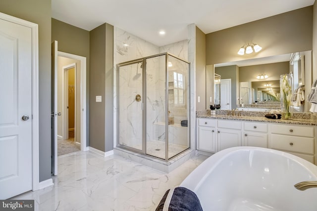 bathroom with vanity and a shower with door