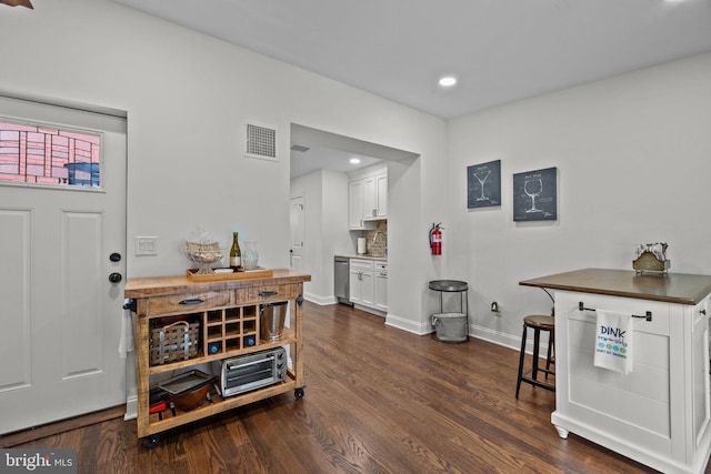 entrance foyer featuring dark hardwood / wood-style floors