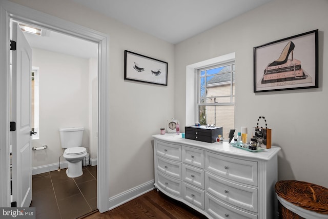 bathroom with vanity, toilet, and wood-type flooring