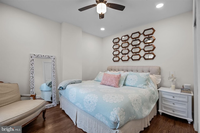 bedroom with ceiling fan and dark hardwood / wood-style flooring