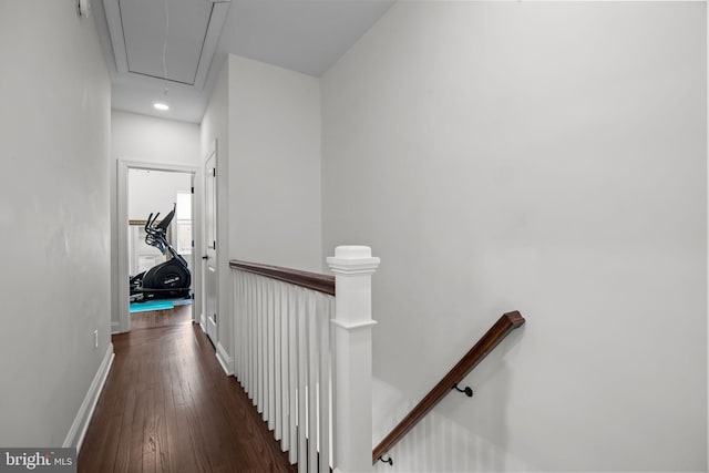 hallway with dark hardwood / wood-style flooring