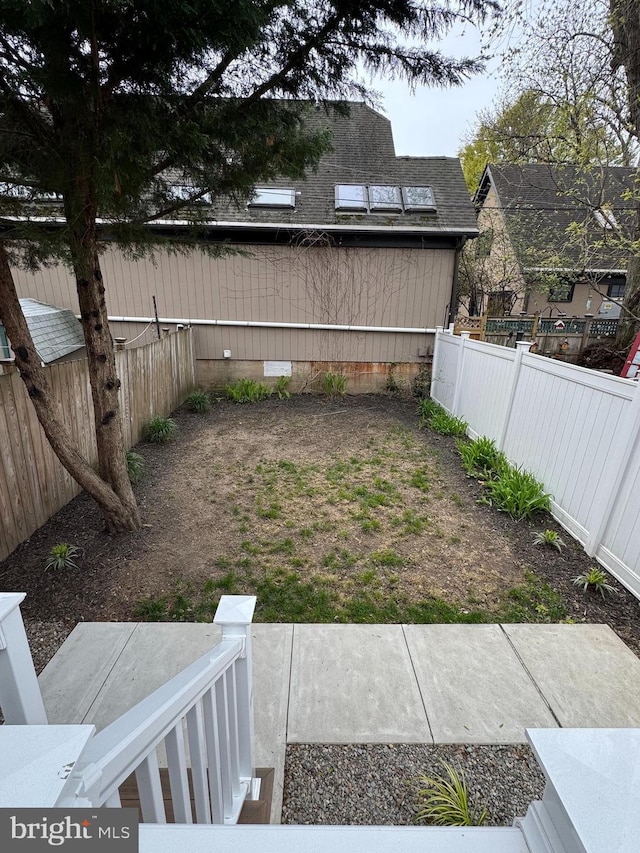 view of yard featuring a fenced backyard and a patio