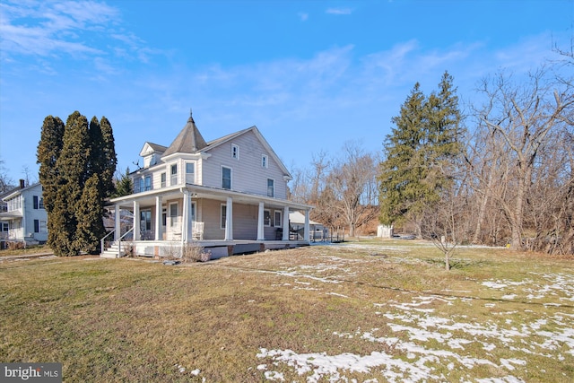 exterior space featuring covered porch and a lawn