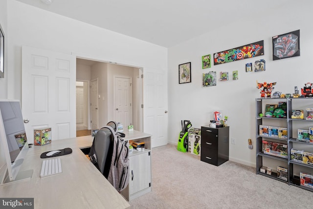 office area with light colored carpet