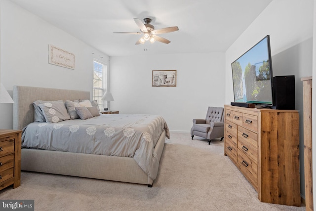 bedroom with ceiling fan and light colored carpet