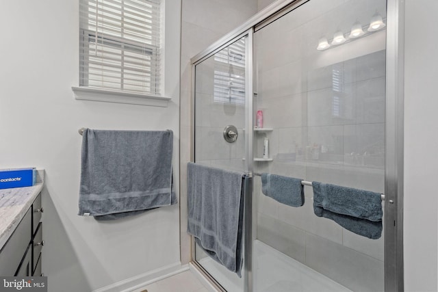 bathroom with vanity and an enclosed shower