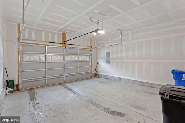 garage featuring electric panel and a garage door opener