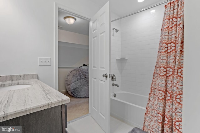 bathroom featuring shower / bathtub combination with curtain and vanity