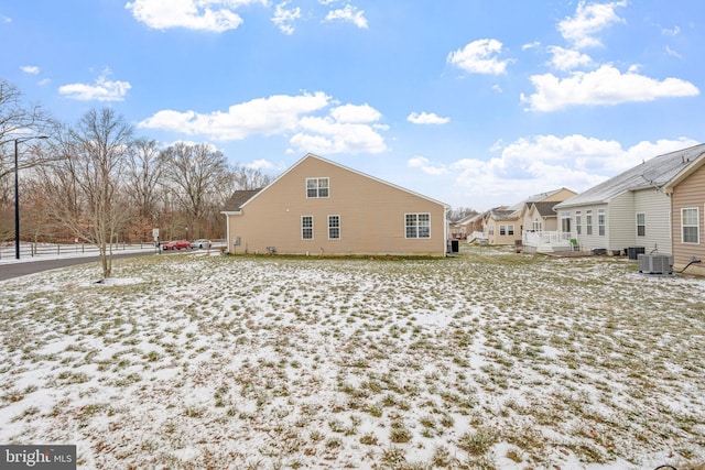 view of snow covered exterior with central AC