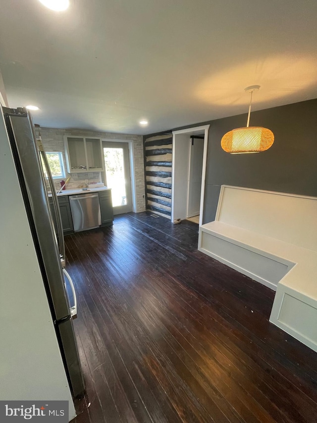 unfurnished living room featuring dark hardwood / wood-style flooring