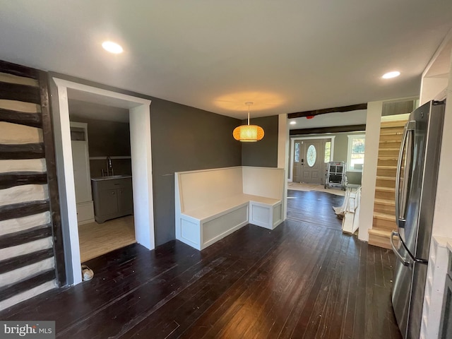 unfurnished dining area with sink and dark hardwood / wood-style floors