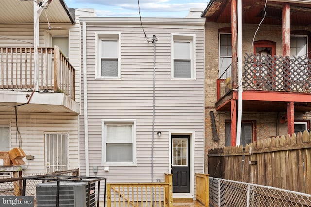 back of house featuring central AC unit